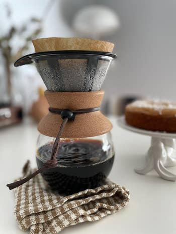 Pour-over java  shaper  with caller  brewed java  connected  a room  counter