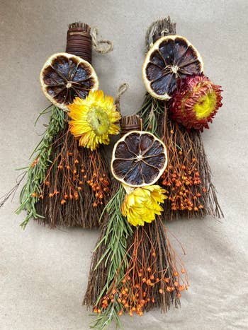 Three dressed brooms