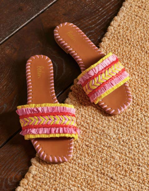 brown slides with pink whipstitch and yellow red and pink raffia straps