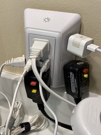 the wall charger with a variety of plugs plugged into it