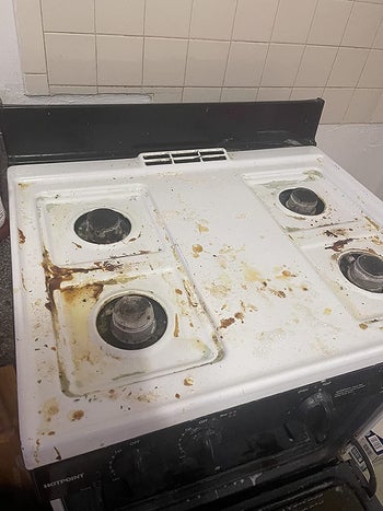 reviewer before image of a stovetop with caked on stains