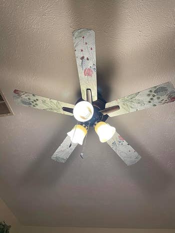 Ceiling fan with lights and patterned blades, suitable for home decor shopping