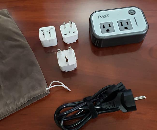 Reviewer photo of adapter, cord, and three different plugs