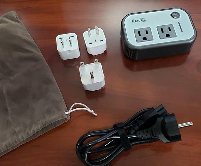 Reviewer photo of adapter, cord, and three different plugs