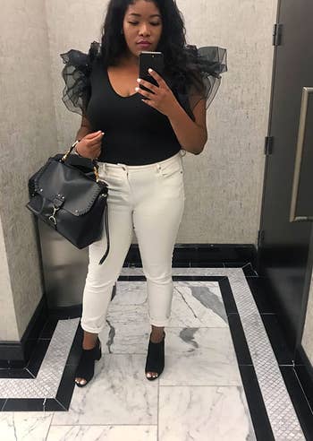 another reviewer wearing the black top with white jeans