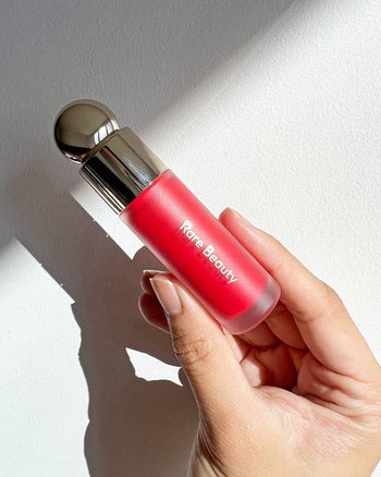 an open tube of the red liquid blush