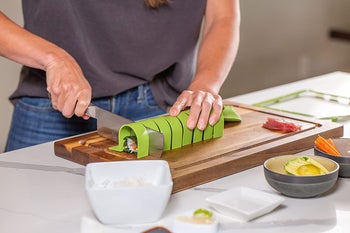 person making the sushi using the kit