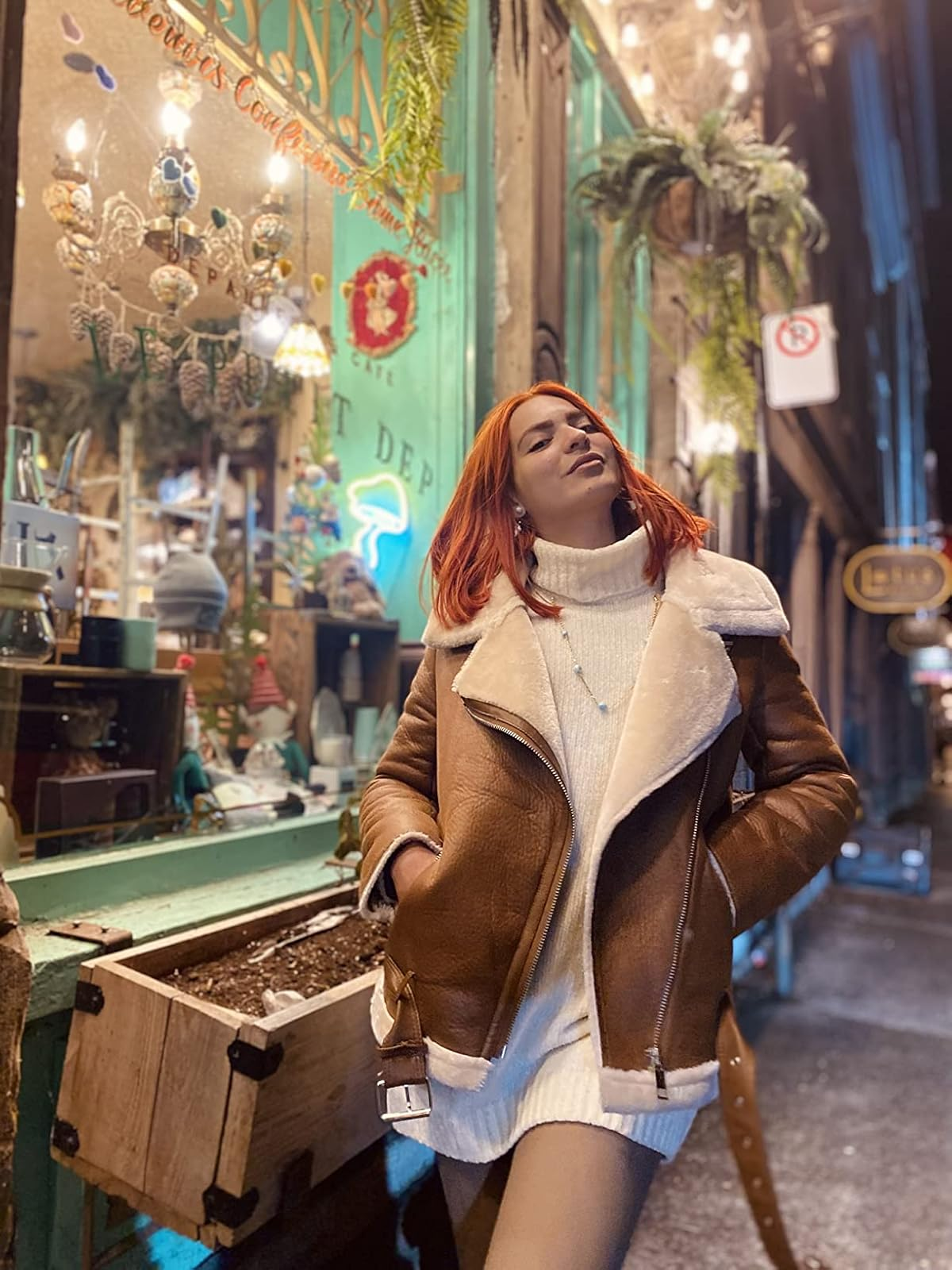 Woman with reddish  hairsbreadth  successful  cozy shearling overgarment  