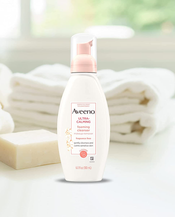 bottle of Aveeno calming cleanser + makeup remover