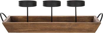 photo showing empty candle holder with wood tray