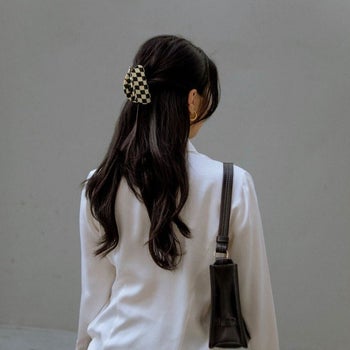 back view of a model wearing the claw clip