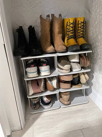 reviewer photograph  of a achromatic  footwear  rack afloat  of antithetic  kinds of shoes