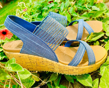 Reviewer image of blue sandals in the grass