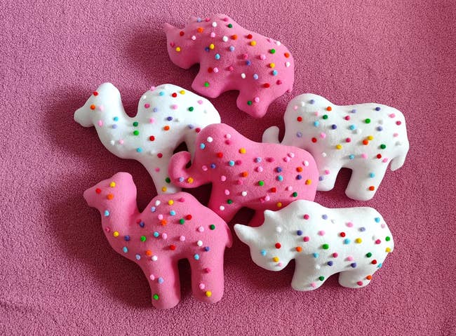 2 camels, 2 elephants, 2 rhinoceroses, placed connected a textured surface