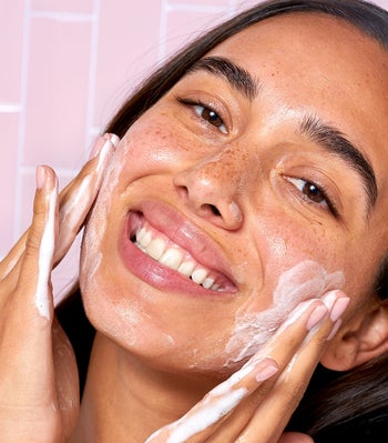 a model applying the cleanser which becomes sudsy