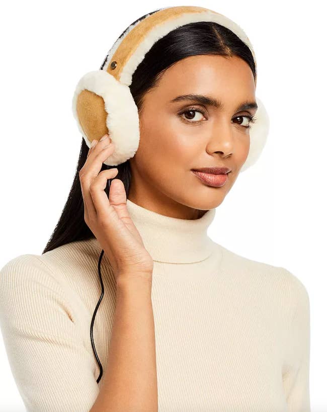 model wearing the ear muffs in the brown color