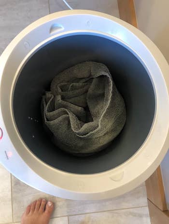 reviewer image showing inside of towel warmer with a towel inside