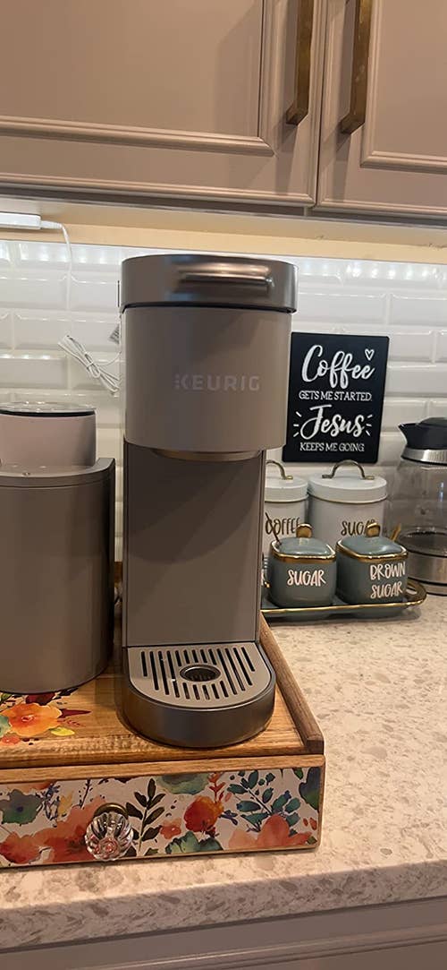 A reviewer's grey coffee maker 