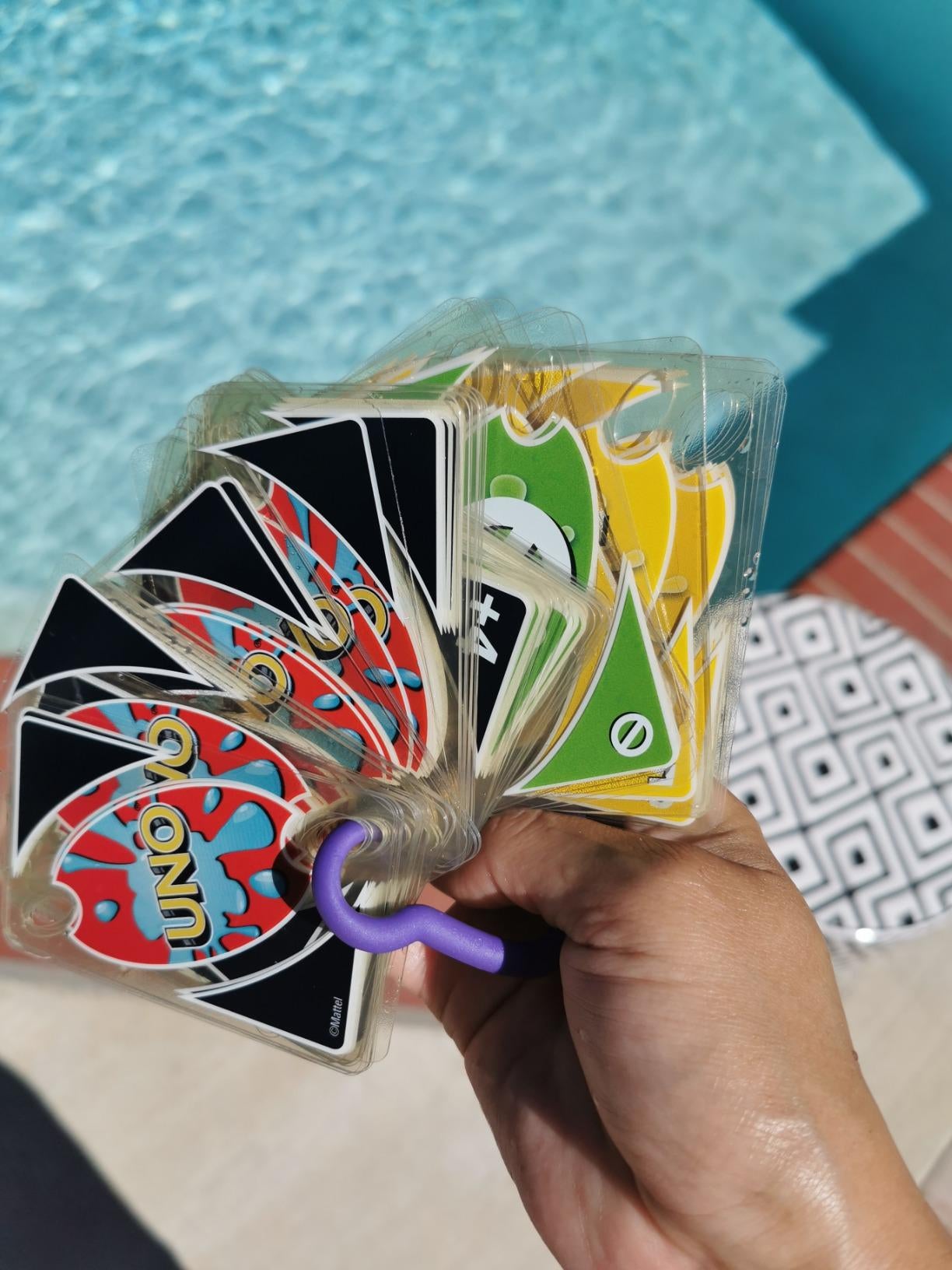 reviewer holding cards on a ring