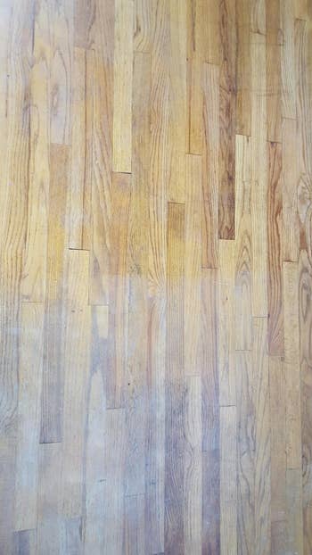 Reviewer's before picture of dull hardwood floor