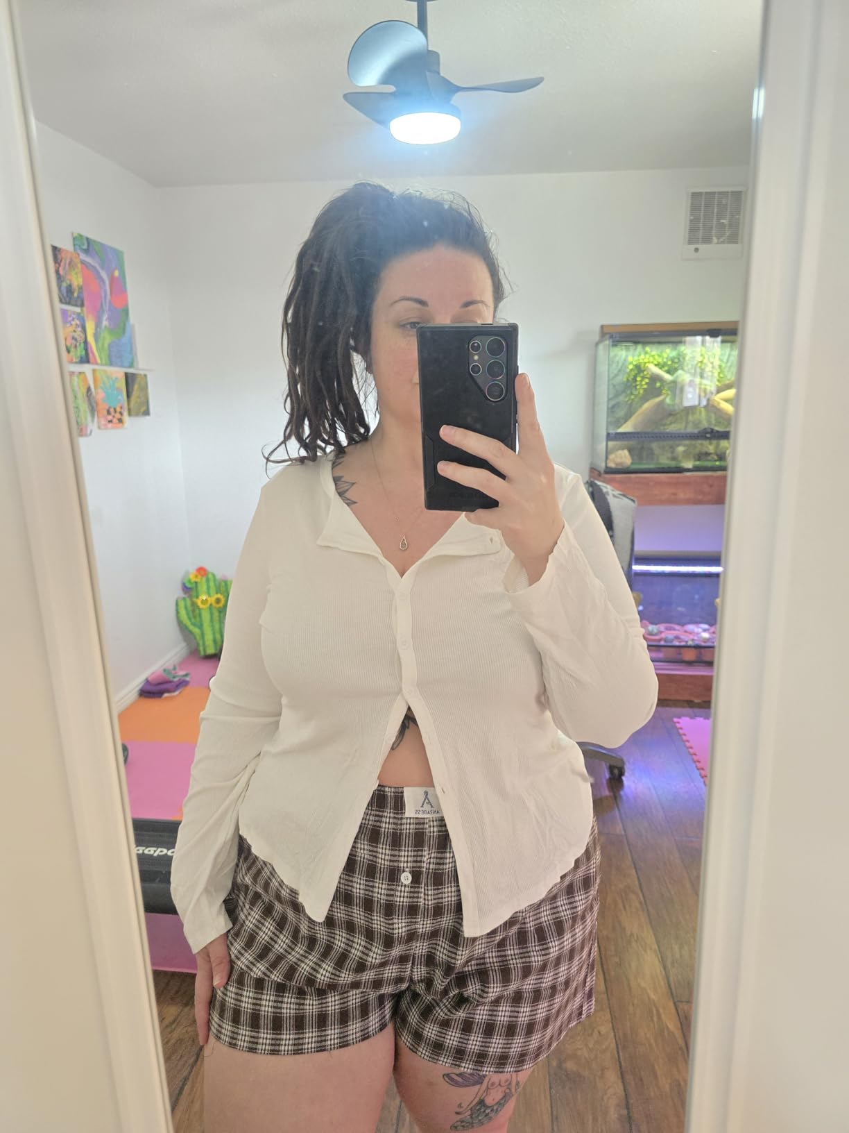 different reviewer taking a selfie wearing the shorts successful  multi-coffee plaid