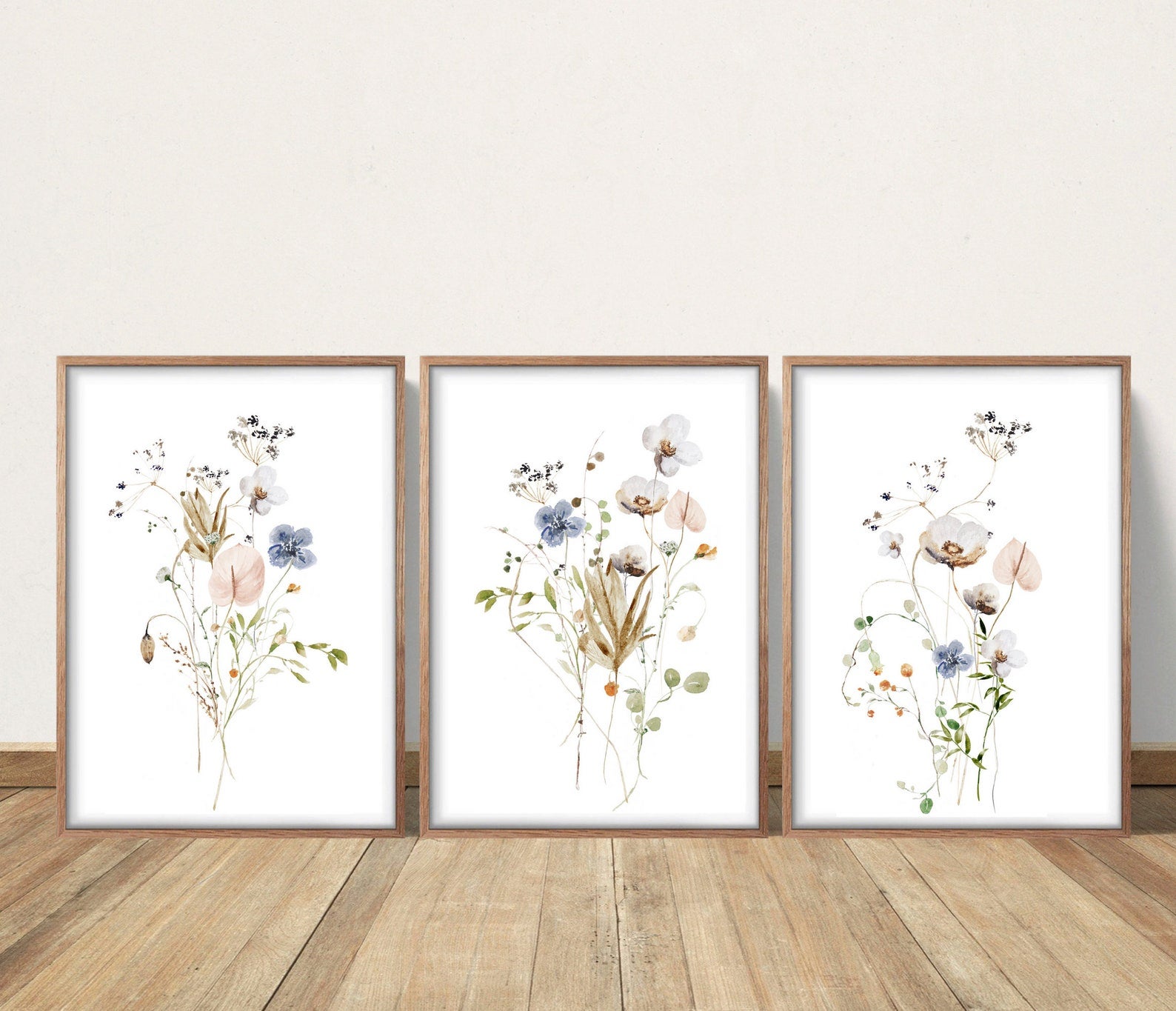 Three paintings of pastel flowers against a white background