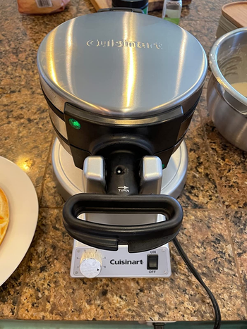 Reviewer image of exterior of silver waffle maker