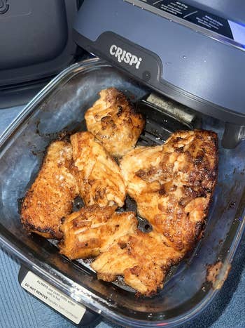 Cooked chickenhearted pieces successful a solid dish, placed wrong an aerial fryer labeled