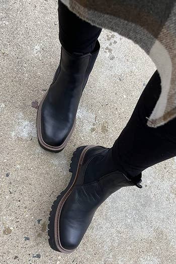 reviewer wearing the laguna boots in black