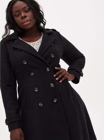 Model wearing the coat buttoned up