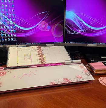 the pink version of the whiteboard on a desk