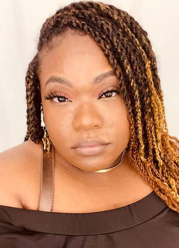 reviewer showing smooth looking makeup with the primer on