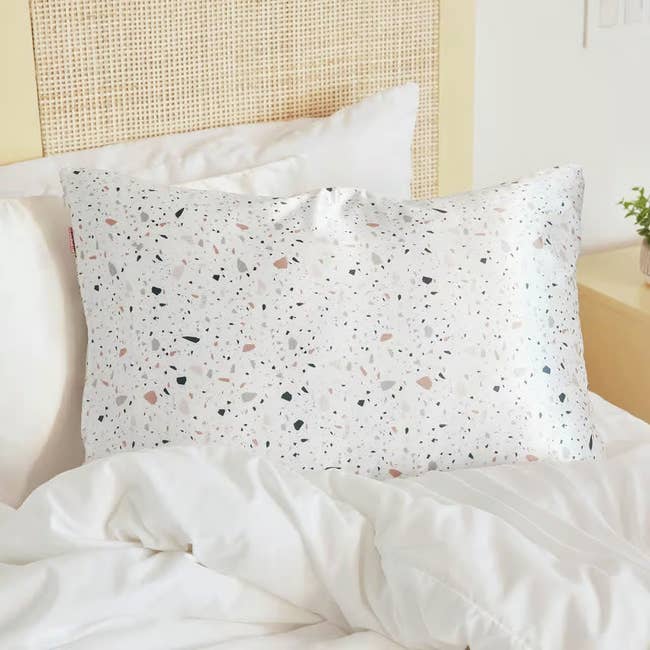 the white pillowcase with colored terrazzo print all over it