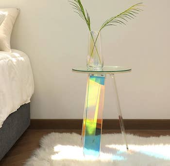 the side table with a plant on top of it