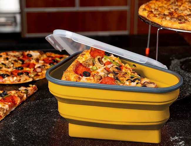 the pizza container in yellow