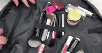GIF of the bag full of makeup and person pulling drawstring closed