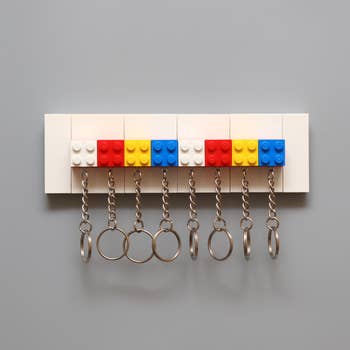 multicolored lego keychains on keyholder