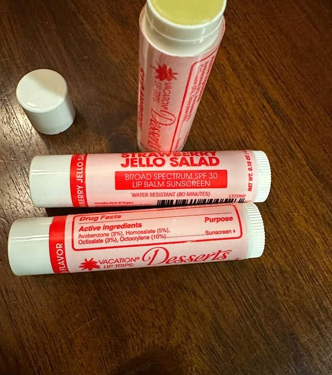 the three-pack of sunscreen lip balm, with one of them having the lid off