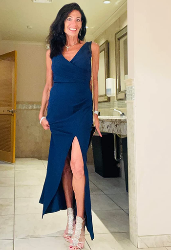 Image of reviewer wearing blue dress