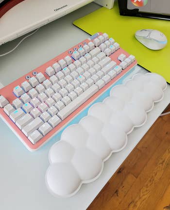buzzfeed editor's logitech keyboard with pink faceplate and the cloud wrist rest
