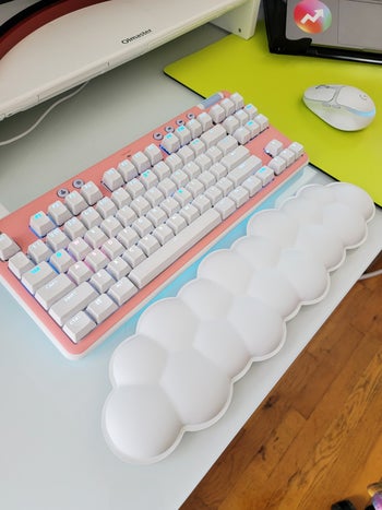 buzzfeed editor's logitech keyboard with pink faceplate and the cloud wrist rest