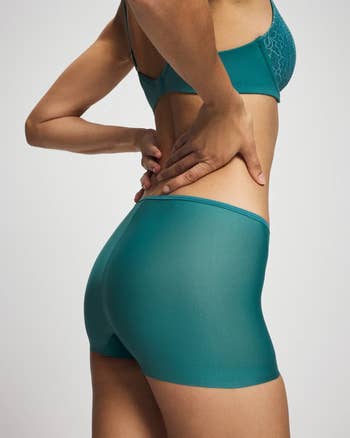 different exemplary wearing the underwear successful cerulean teal shown from the side