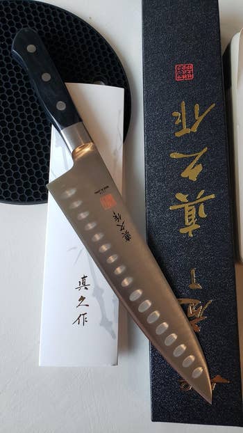 reviewer photo of the knife and its packaging