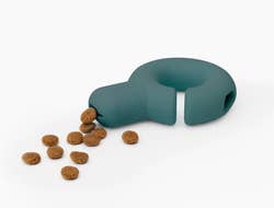 the green falcon toy with kibble coming out
