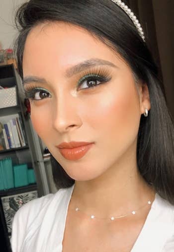 reviewer with smooth looking makeup