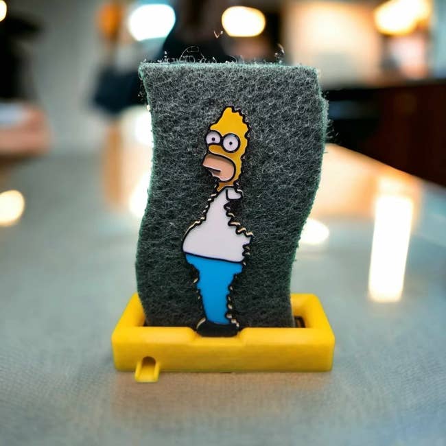 A Homer Simpson sponge holder