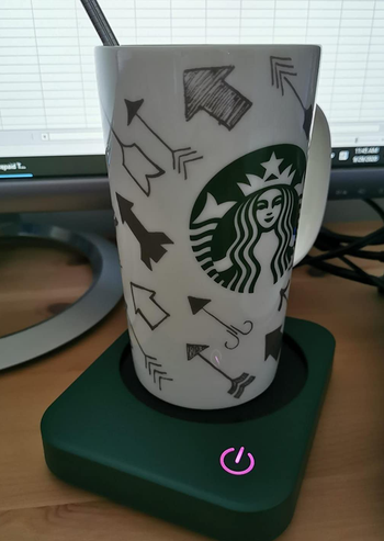 reviewer photo of a mug on the green mug warmer