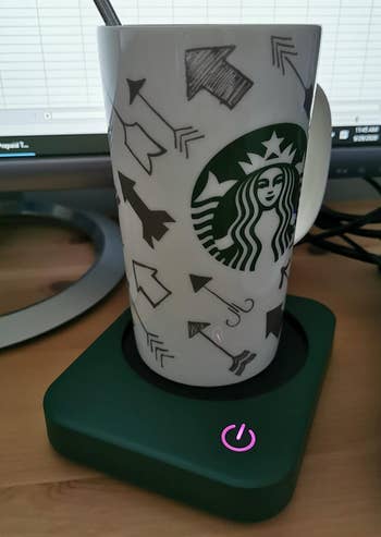 reviewer photo of a mug on the green mug warmer