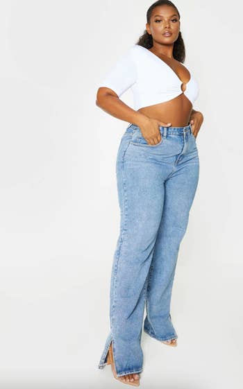 A model posing in the light blue jeans