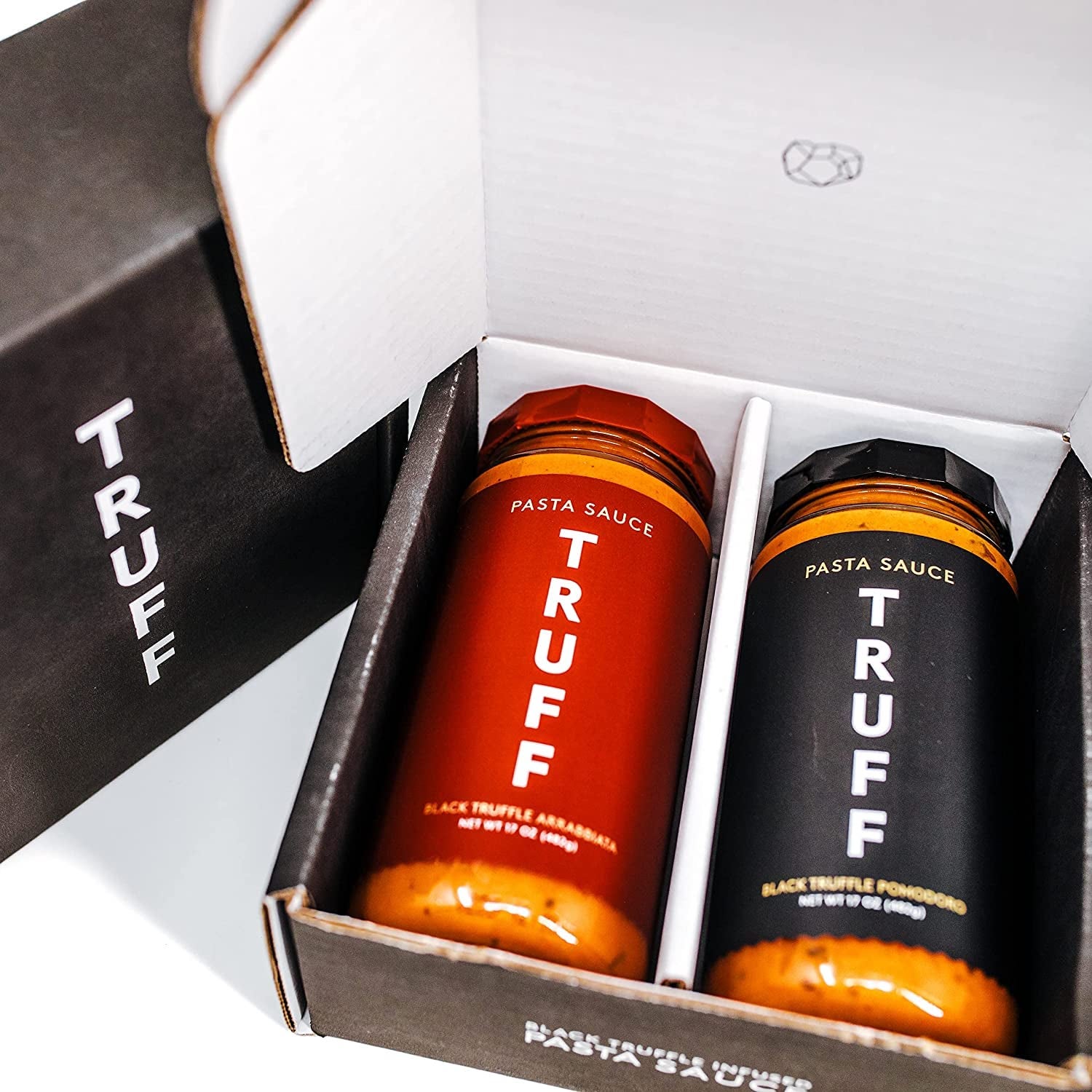 jars of truff pasta sauce in a box